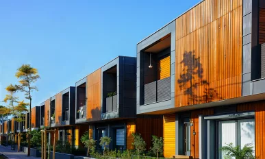 Street of modular houses and trees nearby