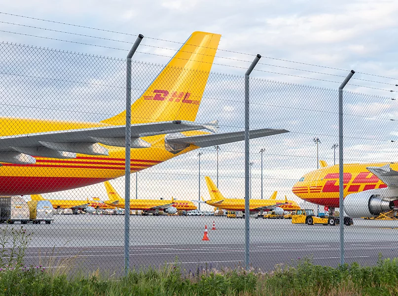 Schkeuditz, Germany - 29th May, 2022 - Many big cargo planes parked on Leipzig Halle airport terminal tarmac apron for loading, service maintenance. DHL air mail express fast logistic hub terminal
